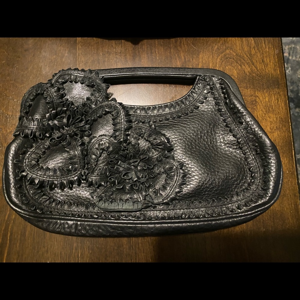 Small black leather handbag.